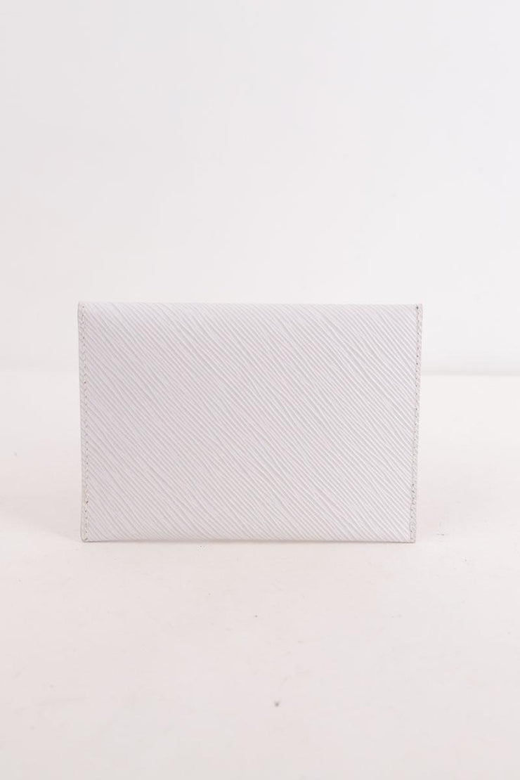 Pochette Louis Vuitton Kirigami blanc. Matière principale cuir.
